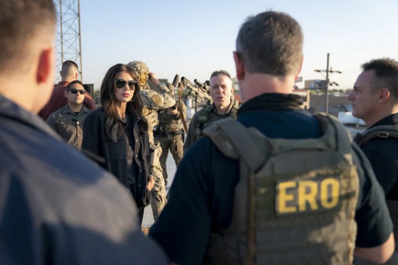 Kristi Noem talking to a group of officers outdoors