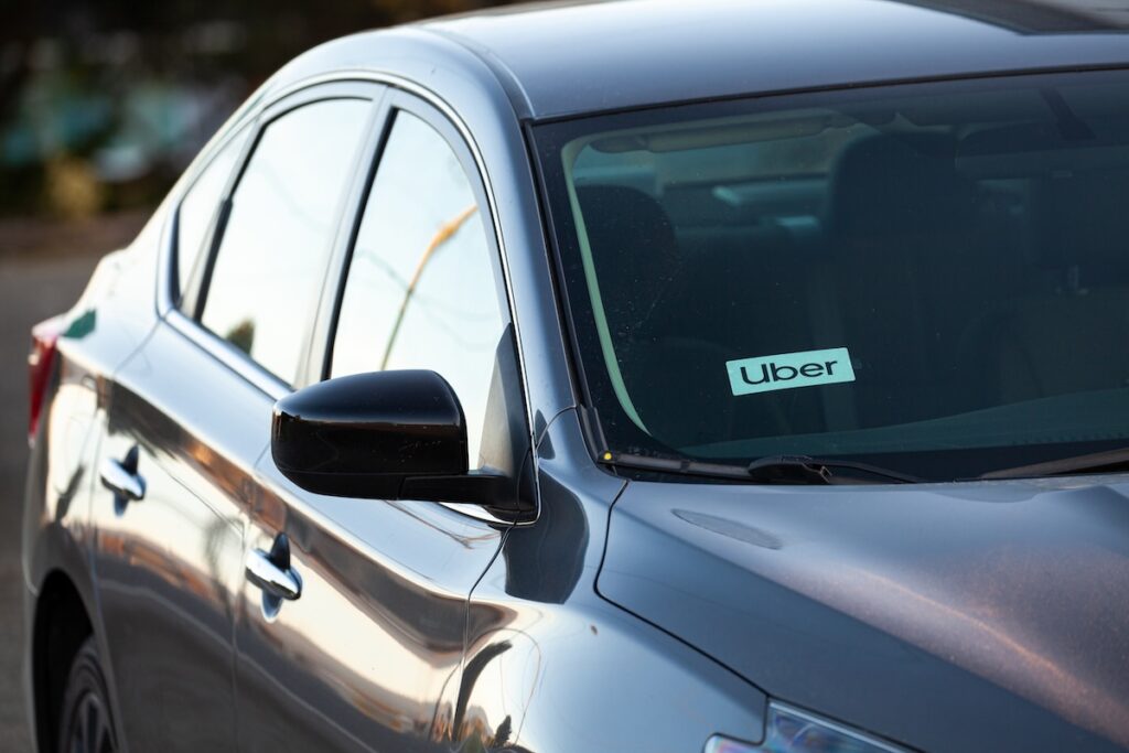 car with Uber sticker on windshield