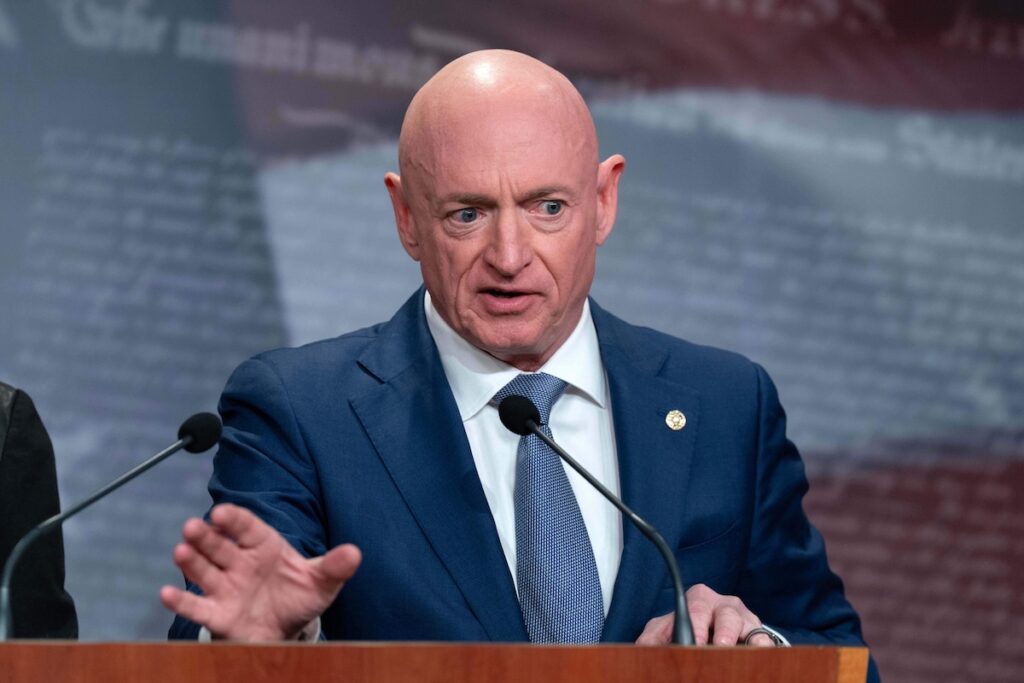 Mark Kelly speaking at podium