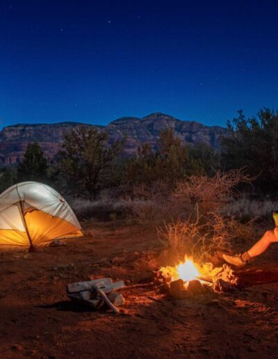 Dispersed camping, also known as free camping or colloquially as boondocking, involves camping for free on public lands, such as national forest or BLM land.