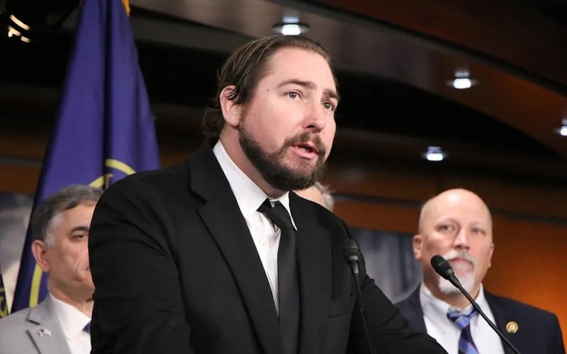 Rep. Eli Crane taking into mic