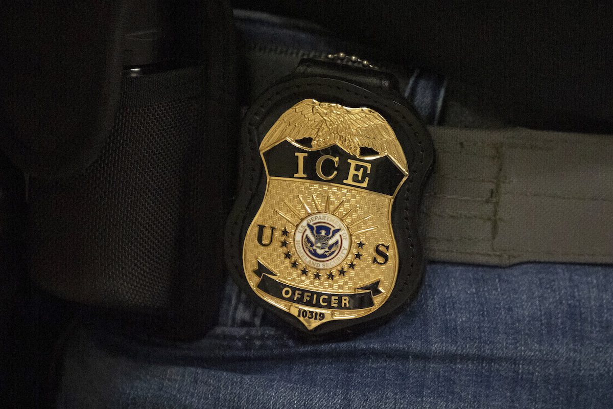 close-up photo of an ICE officer's badge