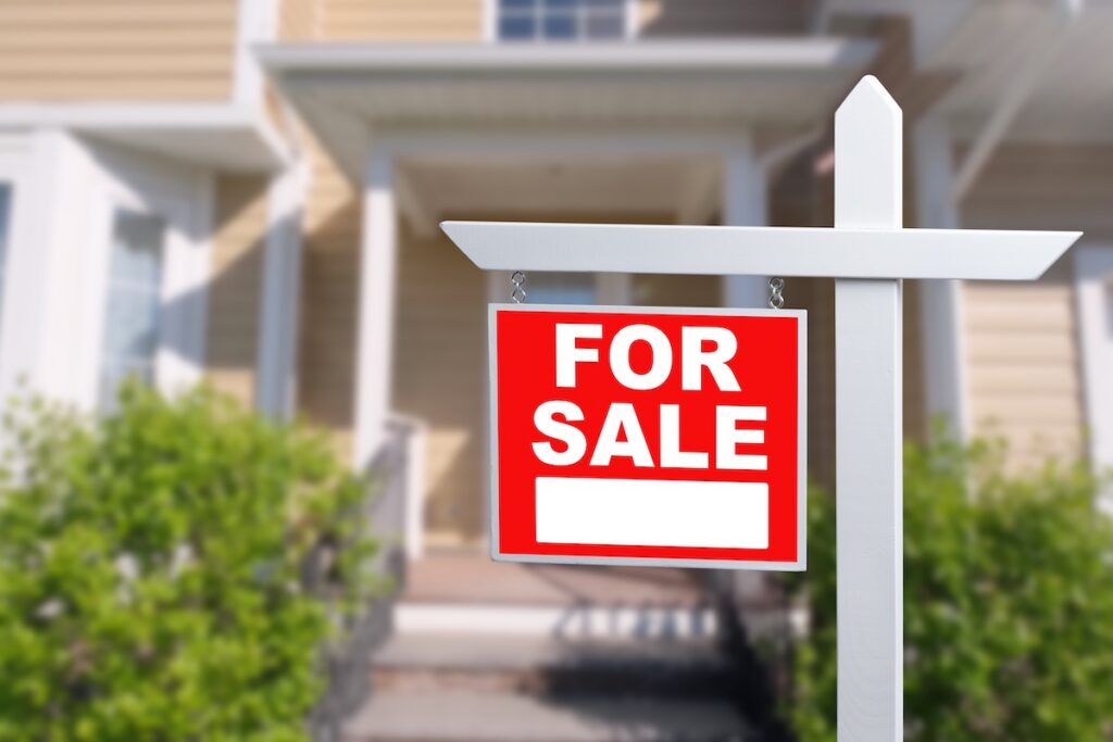 for sale sign outside of a a home