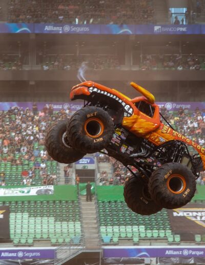 Monster Truck in the air in the center of a stadium