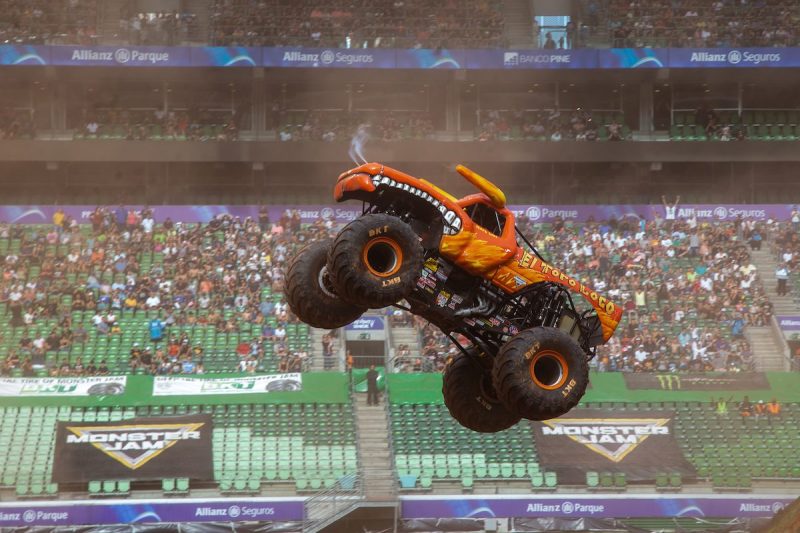 Monster Truck in the air in the center of a stadium