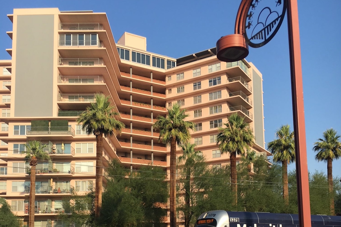 a large pink residential building