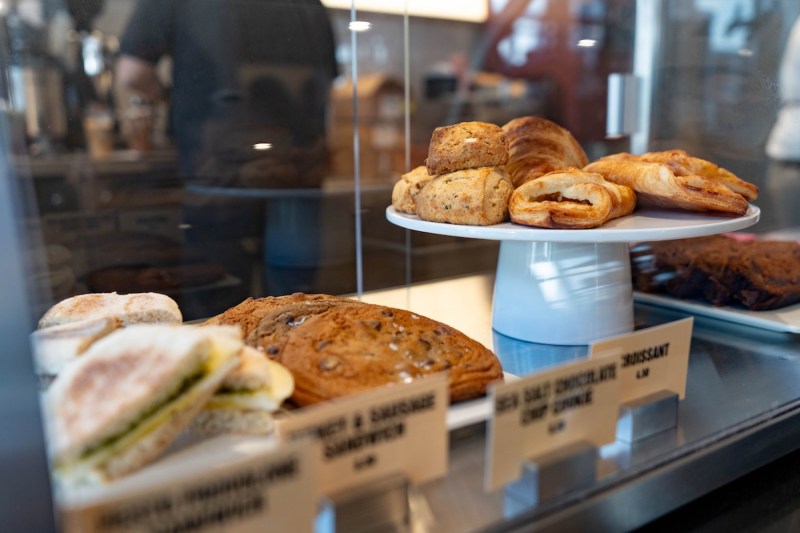 a display of pastries at a coffee shop counter