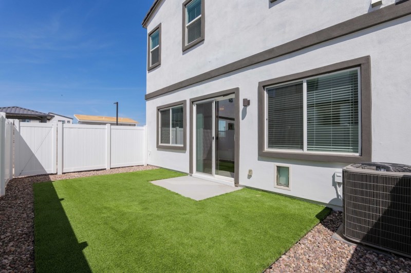 the backyard of a townhome