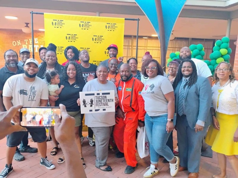 A group of people posing for a photo at a Juneteenth event