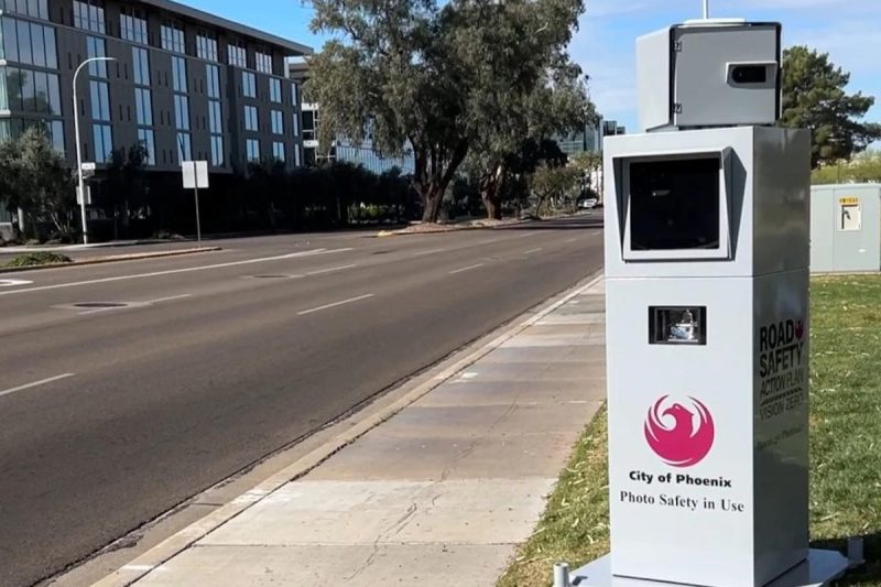 rectangle on the side of the road with city of Phoenix logo and camera