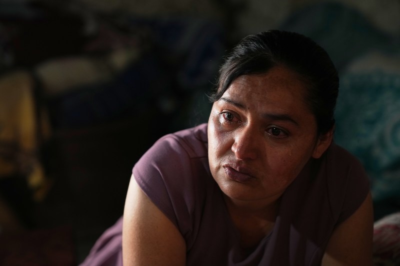 woman crying in a dark room