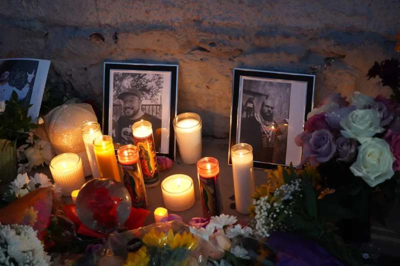 candles and photos at a memorial site