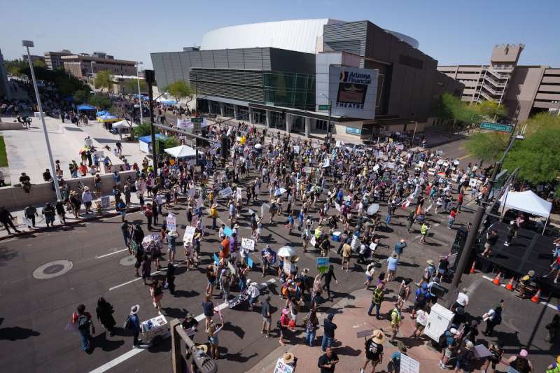 aerial shot of a crowd of protesters in a street